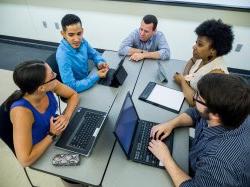 faculty in group work setting